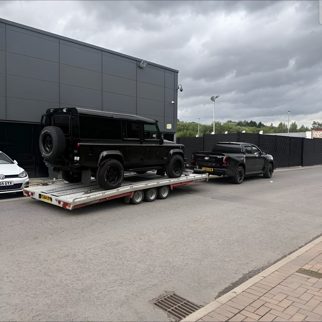 Glasgow Breakdown Recovery flatbed transporting a Land Rover Defender and Ford Ranger